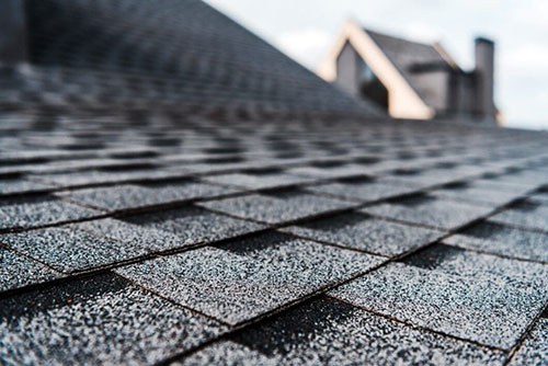 Newly installed roof on a residential home, showcasing high-quality shingles and craftsmanship by Alexander Exteriors in Buffalo, MN.